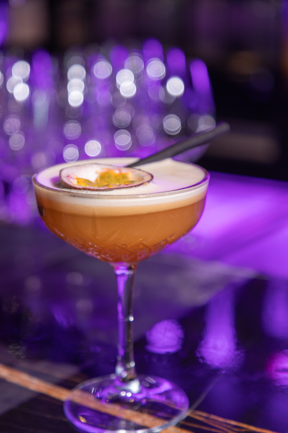 Passion fruit cocktail in a colourful bar