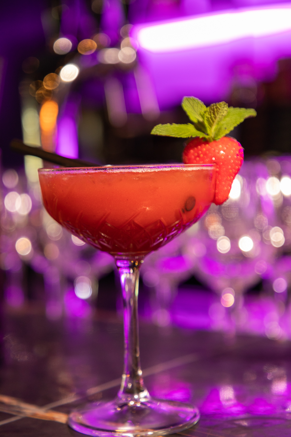 Strawberry Margarita in a colourful bar